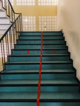 Staircase which the red line to divide into two lanes : up and down (mobile photography)