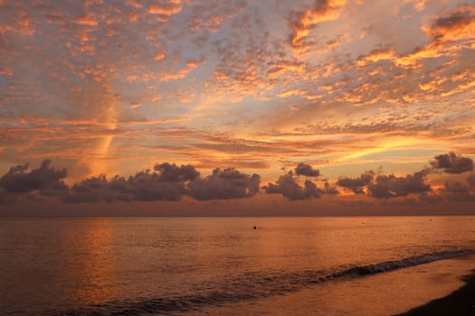 Beautiful cloud coastline abstract background. Fiery orange sunset sky. Amazing sunrise on the beach in Bali Indonesia. Fantastic.