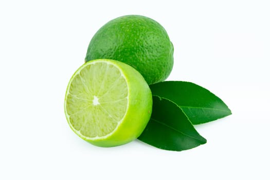Lime with slices half and leaves isolated on white background. Green citrus fruit. with clipping path