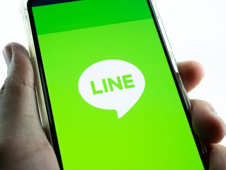 BANGKOK ,THAILAND - MARCH 21, 2020 : LINE application Logo on Huawei P30 Smartphone Display, Is a Most famous Messenger.
