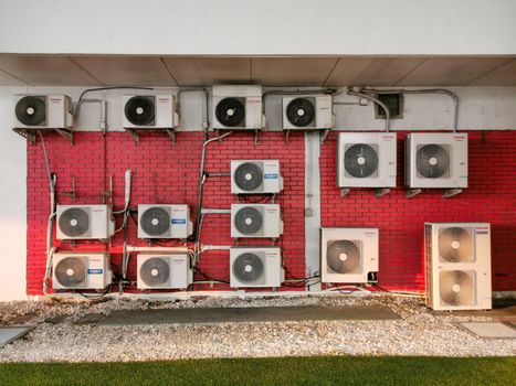 Pathumthani THAILAND, 25 April 2020, Outside Toshiba wall extractor fan air conditioner units on factory.