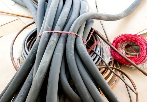 Rubber tubes and wires lay on the cement floor.