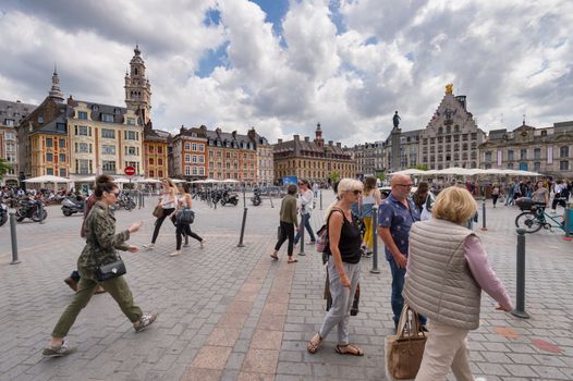 Lille, France - 15 June 2018: People walking in the place du General de Gaulle Square, also called Grand Place or Main Square.