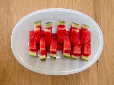 Slices of a ripe watermelon on a plate