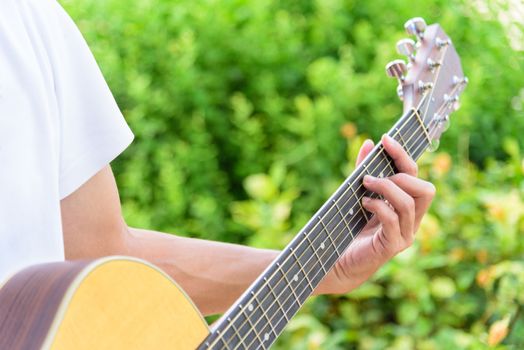 playing guitar in the park