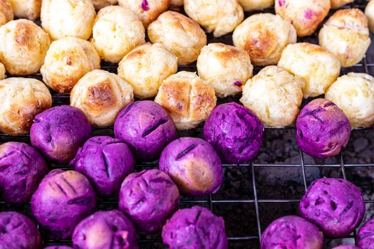 Grilled sweet potato and purple sweet potato  on street food stall