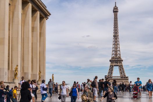 Paris, France - 23 June 2018: Eiffel Tower from Trocadero with many tourists in the foreground