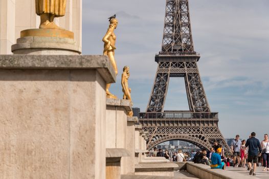 Paris, France - 23 June 2018: Eiffel Tower from Trocadero with many tourists in the foreground