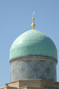 The top of the dome with a Crescent in the ancient Asian style. the details of the architecture of medieval Central Asia