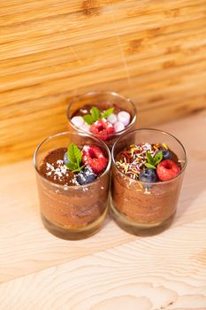 Group shot with glasses filled with chocolate mousse