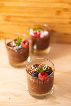 Group shot with glasses filled with chocolate mousse