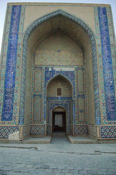 High arch and door with traditional Oriental ornaments. the ancient buildings of medieval Asia