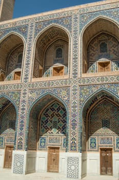 The arch and the exterior design of the ancient Registan in Samarkand. Ancient architecture of Central Asia