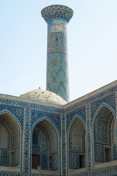 The arch and the exterior design of the ancient Registan in Samarkand. Ancient architecture of Central Asia