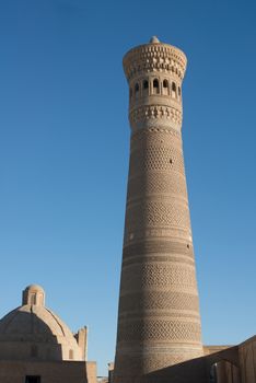 High oval tower of bricks, ancient Asian buildings. the details of the architecture of medieval Central Asia