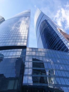 High rise buildings of the business center of Moscow. District Moscow-city against the day sky with clouds