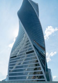 High rise buildings of the business center of Moscow. District Moscow-city against the day sky with clouds