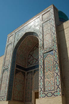 The arch and the exterior design of the ancient Registan in Samarkand. Ancient architecture of Central Asia