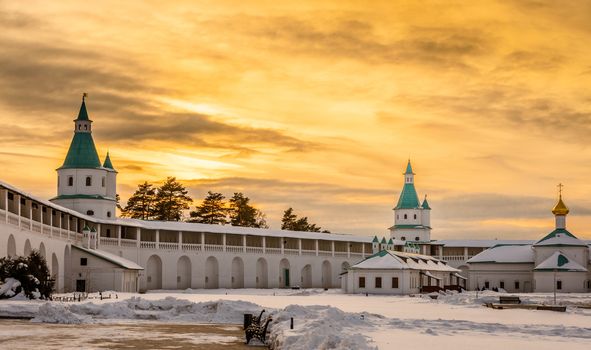 White walls and green towers of New Jerusalem Monastery in sunset lights, Istra, Moscow region, Russia