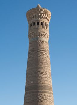High oval tower of bricks, ancient Asian buildings. the details of the architecture of medieval Central Asia