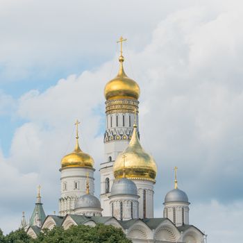 golden domes of the church with crosses against the sky