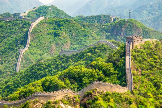 Panorama of Great Wall of China among the green hills and mountains near Beijing, China