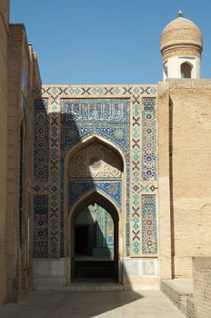 The arch and the exterior design of the ancient Registan in Samarkand. Ancient architecture of Central Asia