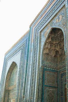 The arch and the exterior design of the ancient Registan in Samarkand. Ancient architecture of Central Asia