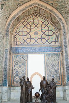 Monument of Mirzo Ulugbek with astronomers in the Registan. Ancient architecture of Central Asia. Ancient architecture of Central Asia