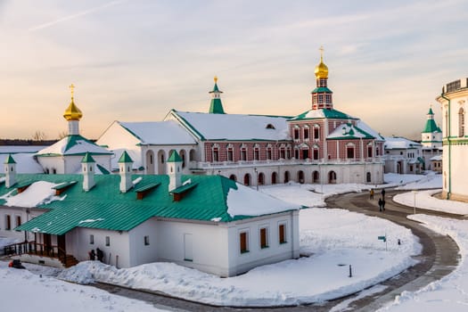 New Jerusalem Monastery inner yard with churches and buildings covered in snow, Istra, Moscow region