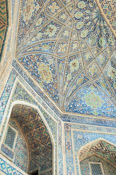 The ceiling is carved with ancient Asian ornament. the details of the architecture of medieval Central Asia