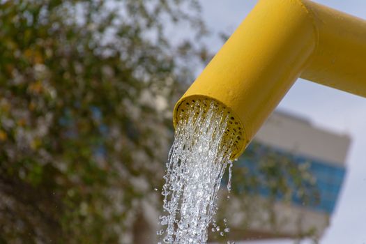 Summertime fun for the kids at the splash pad to play with water falling from bright colored fountains.