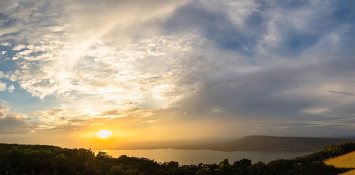 Dramatic sunset clouds on sky in a summer evening