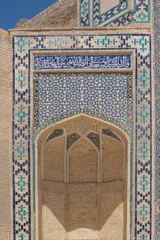 High arch with traditional Eastern ornaments. Ancient buildings of medieval Asia. Bukhara, Uzbekistan