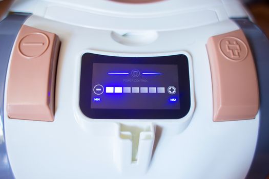 Interactive display for increasing and decreasing power on a household appliance. Power control panel of a modern vacuum cleaner