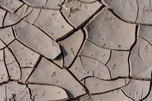 Dried Mud Design in the Sunshine in the desert of the United Arab Emirates (UAE) after a flood and storm near Jebal Jais mountain in Ras al Khaimah.