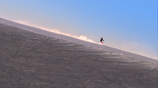 Skier enjoying the slopes in the morning at the Austrian Alps near Innsbruck