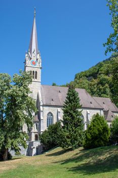 "Vaduz, Vaduz/Liechtenstein -  08/09/2018: Vaduz Cathedral in Liechtenstein near Switzerland on a sunny day with blue skies."