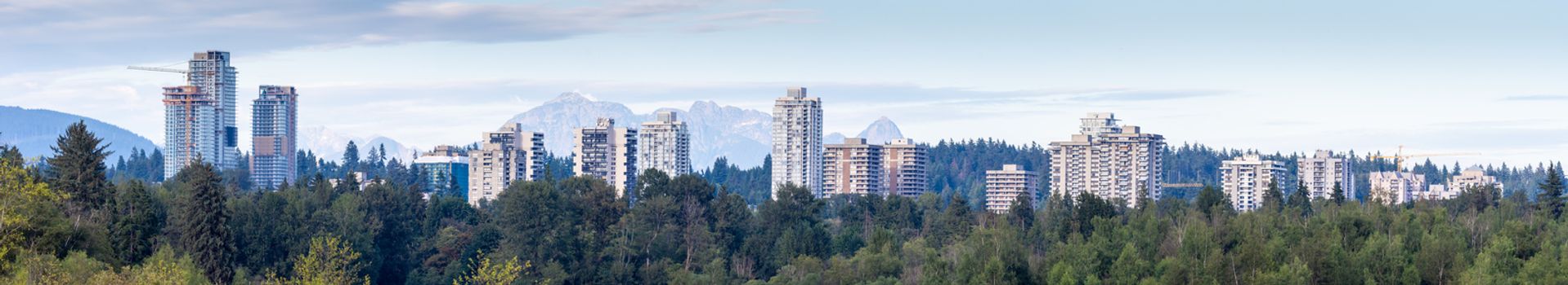 Panorama of the Burnaby, British Columbia, Canada apartment development skyline looking towards the Burnaby and Maple Ridge Mountains.