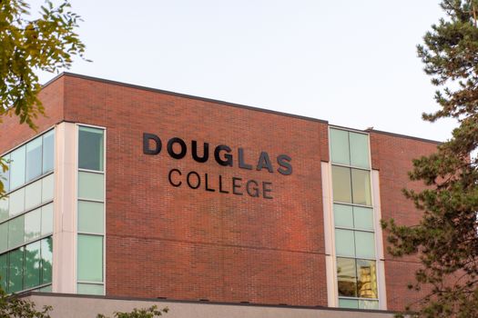 "New Westminster, British Columbia/Canada - 8/3/2019: Douglas College campus view of sign and campus in New Westminster British Columbia an educational community college."