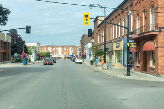 "Brighton, Ontario/Canada - 07/22/2019: Downtown rural sreet of small town Canadian city of Brighton near Pesquile Lake Provincial Park in the summer cloudy and sunny day."