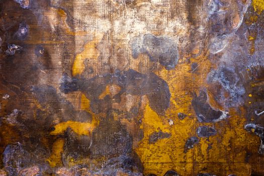 texture and background of old oxidated sheet of brass with with white patina stains and spots and some minor scratches.