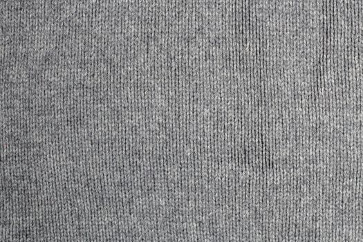 old gray warm wool sweater texture and background.
