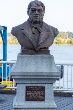 "New Westminster, British Columbia/Canada - 8/3/2019: On the Quay, a Statue of historic figure Simon Fraser marking his voyage and discovery in the 18th Century."