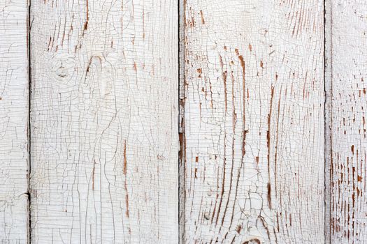 old wooden planks painted into white close-up background.
