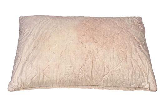 dirty used spotted pillow isolated on white background in slanted frontal perspective.