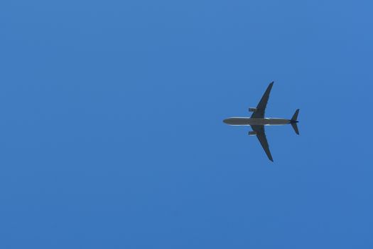 Bottom View of the Airplane in the sky with blank copy space for travel comcept