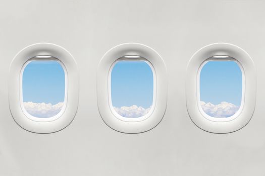 Isolated airplane window with blue sky from customer seat view