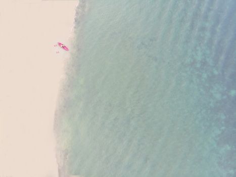 Aerial View of Sandy Beach with kayak boat with Blue Sea