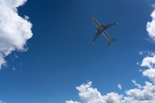 Bottom View of the Airplane in the sky with blank copy space for travel comcept